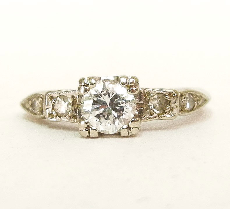 White gold diamond solitaire engagement ring, roun: White gold diamond solitaire engagement ring, round transitional cut center stone measures approximately 1/3 carat (33 points), two diamond accents on either side, marked 14K, size 4, weight 2.0 grams