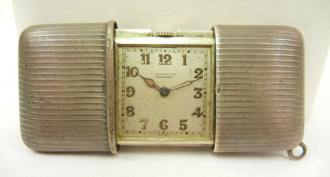 Movado sterling silver sliding case travel watch,: Movado sterling silver sliding case travel watch, 1 7/8" long x 1 1/4" high when closed, ridged design on case, face marked Chronometre Movado, back marked Swiss made .935 1187691, has ring for chain,