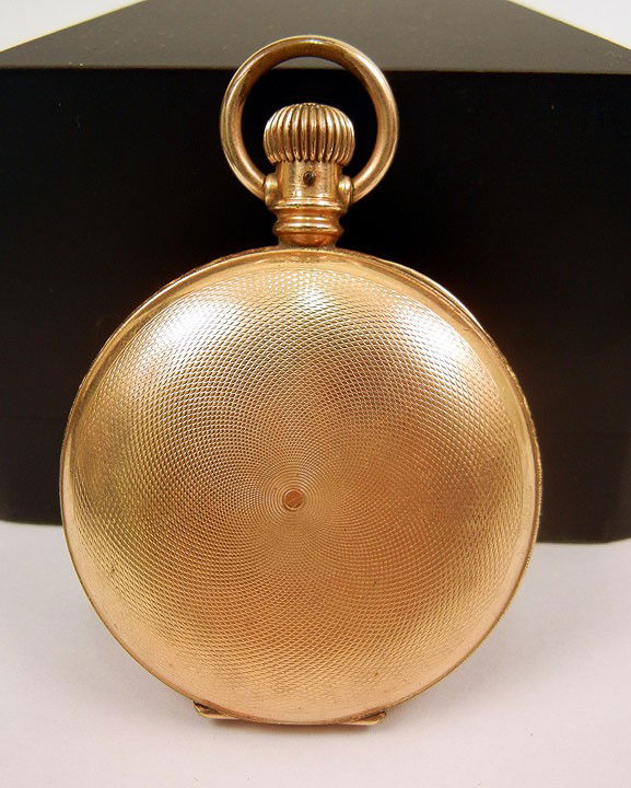 Gold filled pocket watch, hunting case with engine: Gold filled pocket watch, hunting case with engine turned design, 2 1/8" diameter, Trenton Watch Co. on face, case stamped 189190, C. 1920