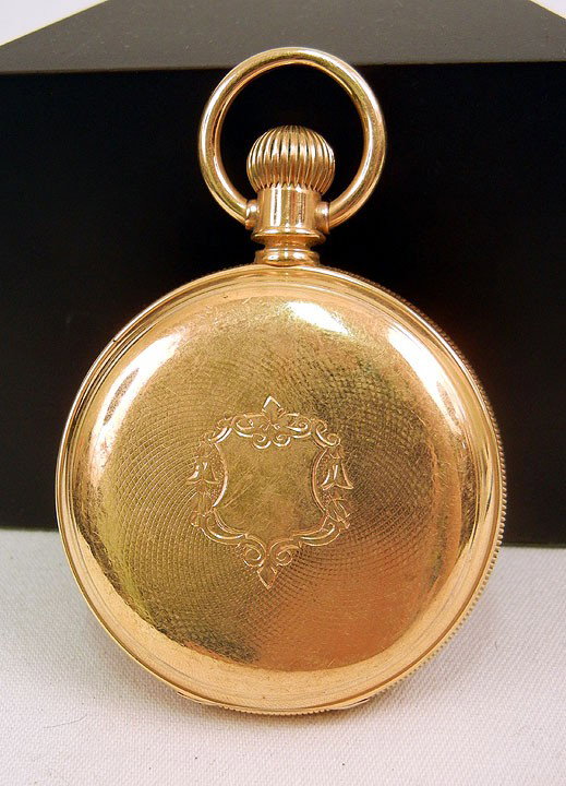 Elgin 18K gold cased pocket watch, hunting case wi: Elgin 18K gold cased pocket watch, hunting case with engine turned design on front and back, 2" diameter, inside marked 4838362, case marked Mc. C. & H., Warranted 18K U.S. Assay 10405, C. 1920