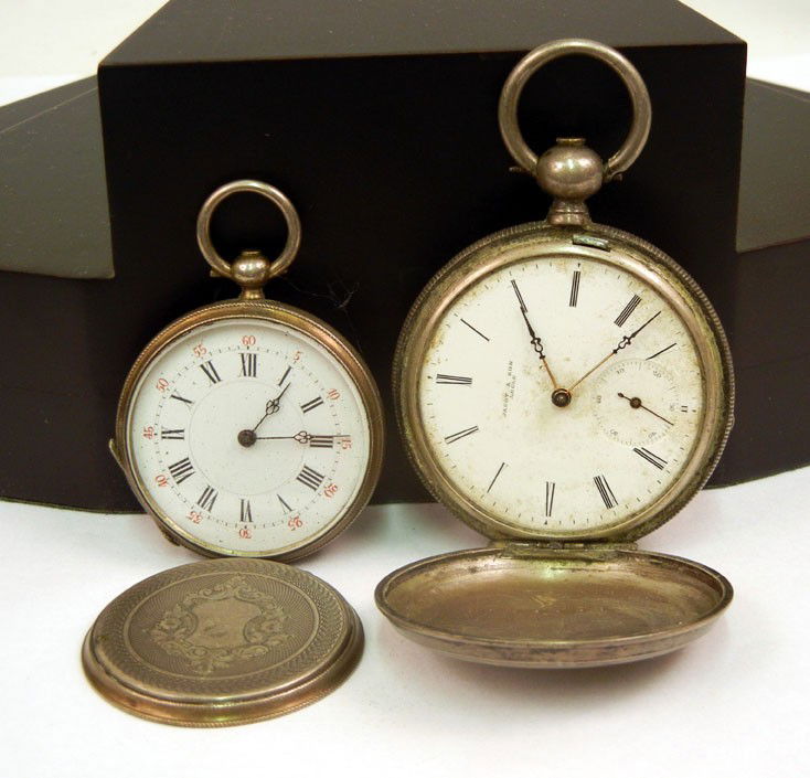 Two silver cased pocket watches one key wind with: Two silver cased pocket watches one key wind with hunting case, 1 3/4" diameter, face marked Jacot & Son Locle, inside dust cover marked with number 13991, case stamped F & H, and one open face key wi