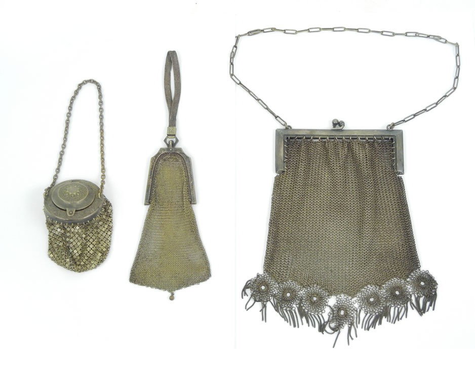 Three German silver mesh purses, one 6 1/2" long x: Three German silver mesh purses, one 6 1/2" long x 4" wide, fancy fringed bottom, 16" long handle, marked German Silver, one 5 1/2" long x 1 3/4" wide, 2 1/2" long mesh handle, jeweled clasp (as is), 