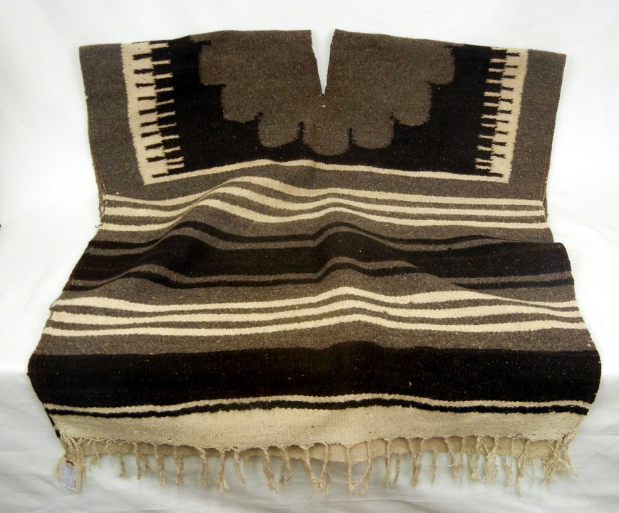 Two Navajo weavings, poncho and saddle blanket, po: Two Navajo weavings, poncho and saddle blanket, poncho measures 63 1/2" long, saddle blanket measures 50" long, early to mid 20th C.