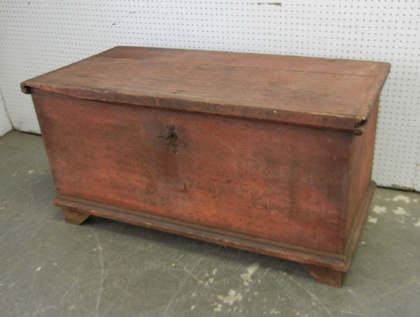 Pine blanket chest, original red paint remnants, b: Pine blanket chest, original red paint remnants, bracket feet, interior iron strap hinges, dovetailed construction, iron escutcheon and key, interior till, mid 19th C., 25 1/2" x 50" x 24