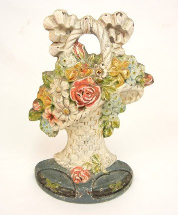 Cast iron flower basket doorstop: Cast iron flower basket doorstop, 10 1/2" high, early 20th C.