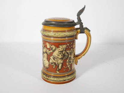 Mettlach German Pottery Beer Stein: Mettlach German pottery #2057 Peasants Dancing 1/2 litre beer stein, impressed marks on underside of base, pewter lid with inlay, Northwinds face pewter thumb rest, late 19th/early 20th c., 6 1/2"