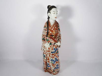 Japanese Kutani Porcelain Female Figure: Japanese Kutani porcelain figure of a standing female form with a colorful floral kimono, unmarked 19th/20th c. Meiji period, 24" high x 7"