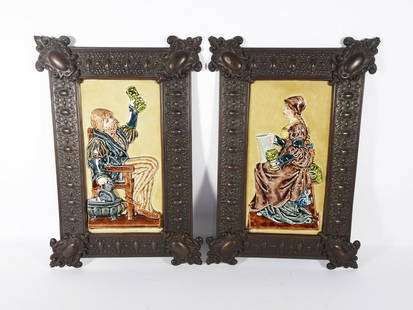 Pair Continental Majolica Figural Plaques: Pair of Continental Majolica figural wall plaques, three dimensional plaques with seated female and male figures that are set into brass toned metal frames, late 19th/early 20th c., KCB 153 incised ma