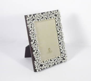 L'objet Picture Frame w/Swarovski Crystals: L'objet style F7000-S picture frame, brown leather frame with platinum color metal garland mounts that have inset Swarovski crystals, comes with its original box, contemporary 20th c., 6" high x 4"