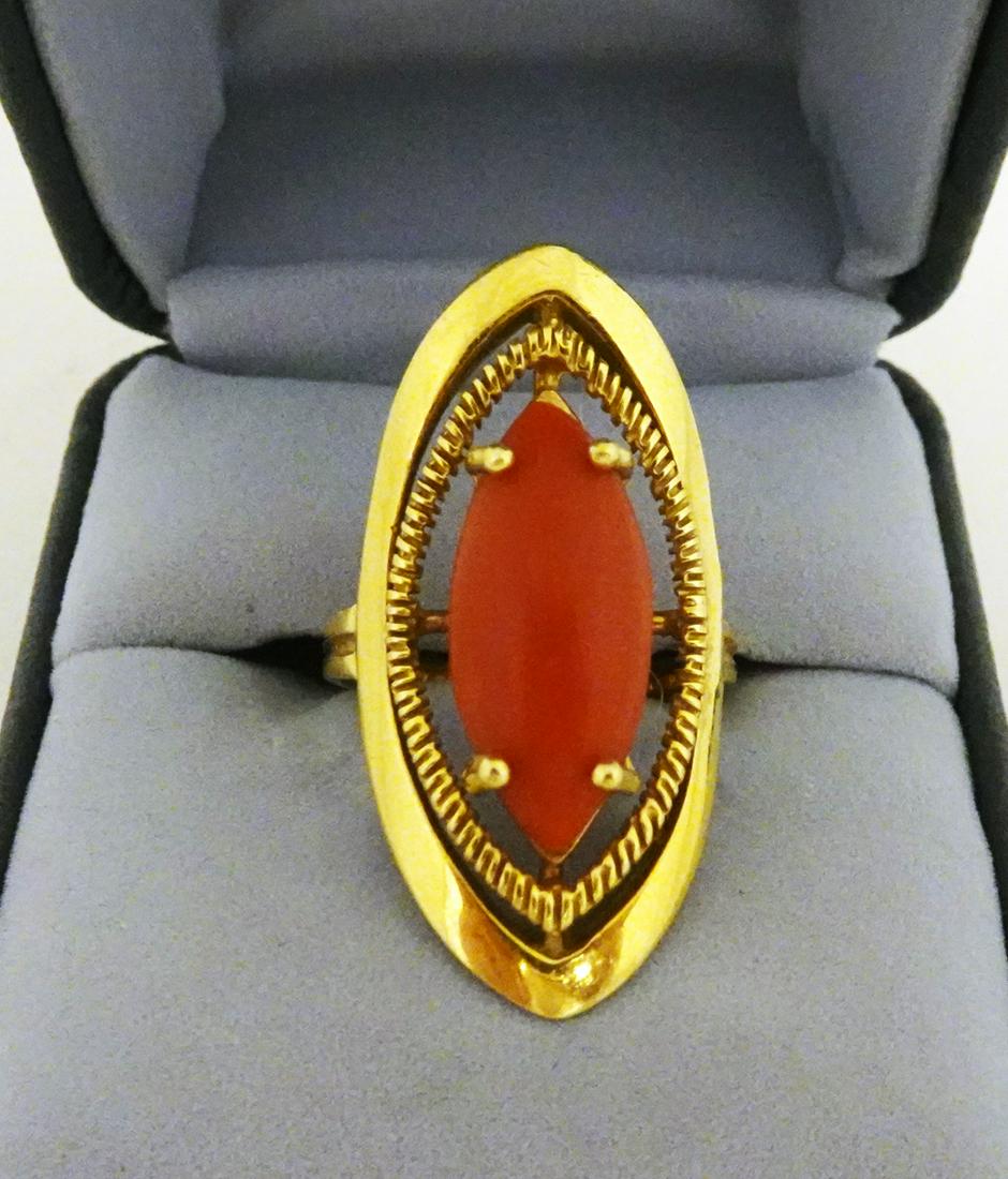 Coral and 18K Yellow Gold Ring: Coral and 18K yellow gold ring, 4.1 dwt, stamped: 750, 33z17mm overall, 19x8mm marquise shaped cabochon red coral in four prong center with yellow gold frame, finger size: 7 1/2