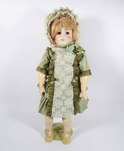 Antique bisque doll attributed to Kestner: Antique bisque doll, attributed to Kestner, closed mouth, sleep eyes, jointed wood body with repair to lower torso leg opening, marked 10 on head, 22"