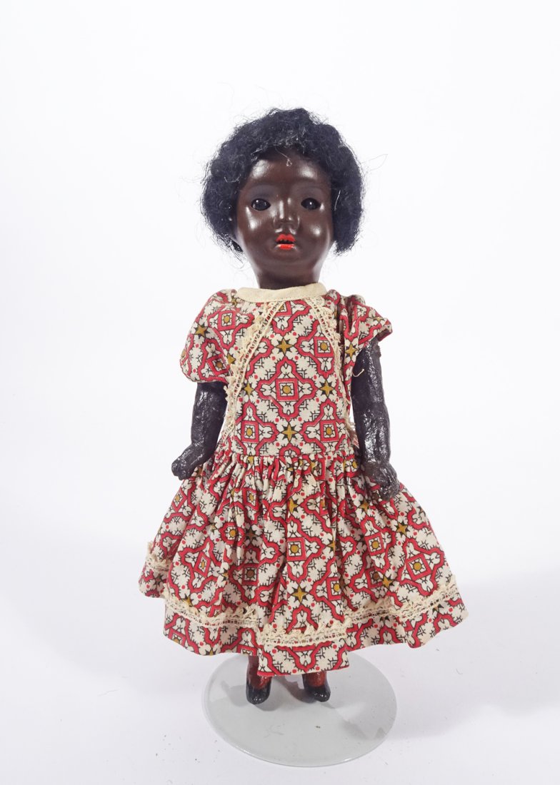 Antique German black bisque doll: Antique German black bisque doll, sleep eyes, open mouth with teeth, five piece body, 8", maker's mark on head (illegible) and marked Germany