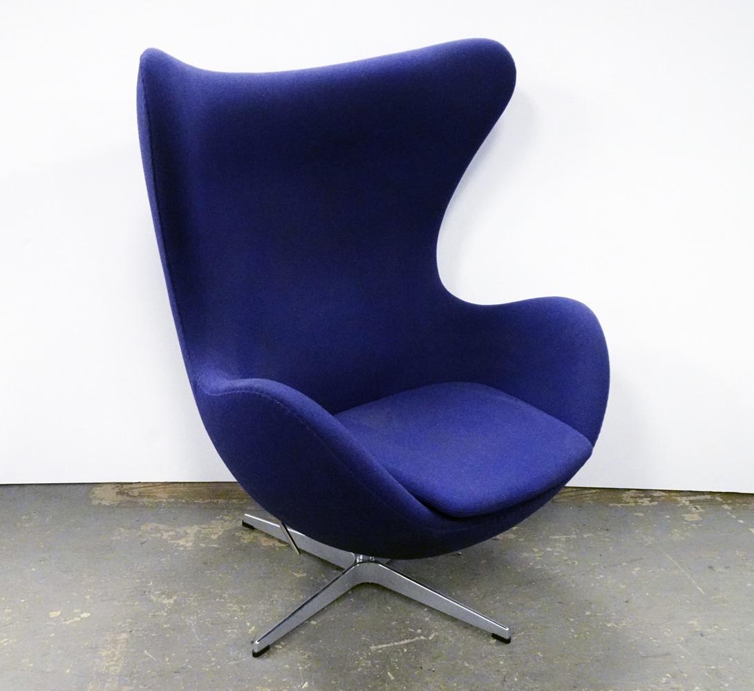 Fritz Hansen Inc. Egg Chair: Republic of Fritz Hansen Inc. egg chair, designed by Arne Jacobsen, blue upholstery with aluminum swivel base, chair has lever and tilts, circa 2016, underside has attached Fritz Hansen Inc. labels an