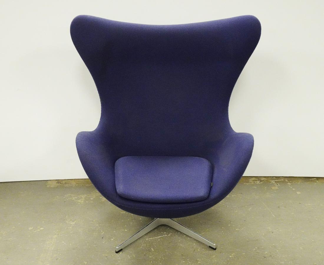 Fritz Hansen Inc. Egg Chair: Republic of Fritz Hansen Inc. egg chair, designed by Arne Jacobsen, blue upholstery with aluminum swivel base, chair has lever and tilts, circa 2016, underside has attached Fritz Hansen Inc. labels an