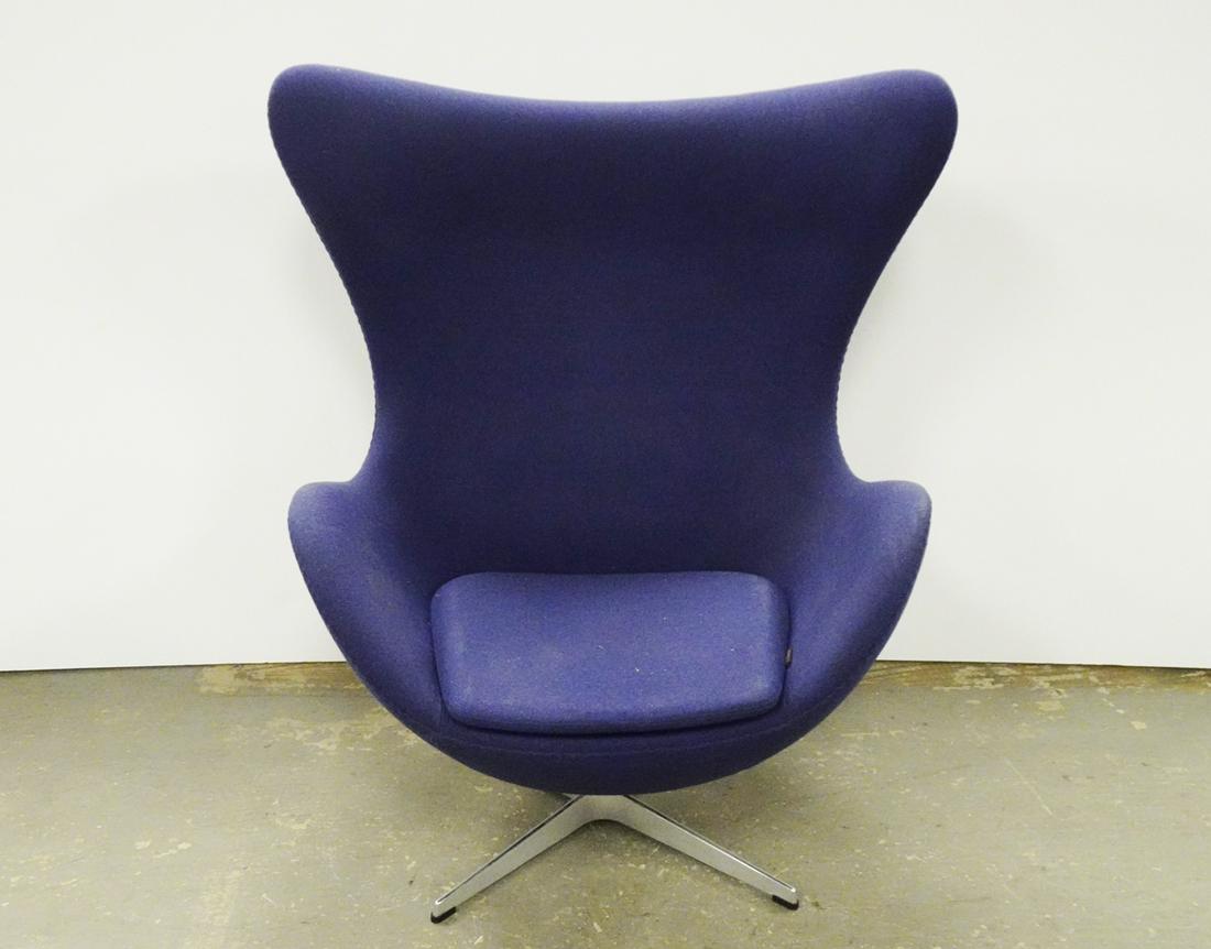Fritz Hansen Inc. Egg Chair: Republic of Fritz Hansen Inc. egg chair, designed by Arne Jacobsen, blue upholstery with aluminum swivel base, chair has lever and tilts, circa 2016, underside has attached Fritz Hansen Inc. labels an