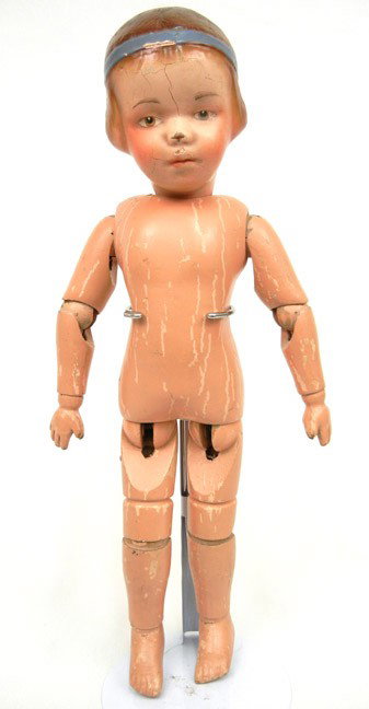 Schoenhut wooden socket head child character girl d: Schoenhut wooden socket head child character girl doll with carved hair, painted and carved blue eyes, closed mouth with molded brown hair and blue head band, ball-jointed wooden body marked on back S