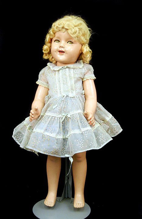 Ideal composition Shirley Temple 25" doll, green sle: Ideal composition Shirley Temple 25" doll, green sleep eyes with applied lashes, open mouth with teeth, dress, slip, and pantaloons, marked on back and neck