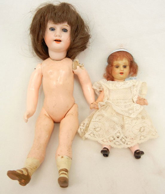 6" Germany Armand Marseille doll, bisque head, comp: 6" Germany Armand Marseille doll, bisque head, composition body, marked "Germany A. 14/0 M." on back of head, and a 9" Morimura Brothers bisque head doll, five piece composition body, blue sleep eyes,
