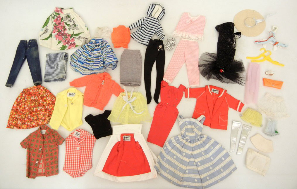 One lot of Barbie doll clothes, some tagged "Barbie: One lot of Barbie doll clothes, some tagged "Barbie by Mattel" and one tagged "Ken TM by Mattel", hats, purse, hangers, etc.