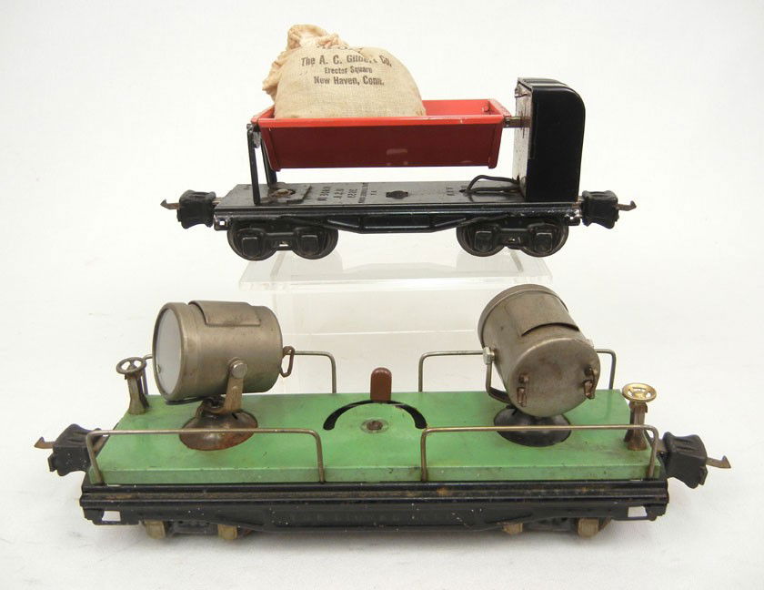 Lionel pre-war "O" gauge freight cars including No: Lionel pre-war "O" gauge freight cars including No. 820 Search light car; No. 3659 dump car with bag of No. 23 Artificial Coal-The A.C. Gilbert Co.