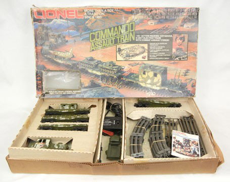 Lionel 1355 Commando Assault train set in original: Lionel 1355 Commando Assault train set in original box, 027 gauge, including engine, four freight cars, eight straight track, twelve curved track, No. 4065 transformer, Lionel booklet, army truck, fig