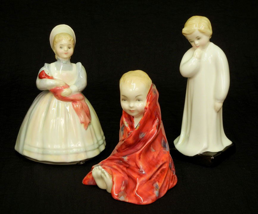 Three Royal Doulton figurines "This Little Pig" HN: Three Royal Doulton figurines "This Little Pig" HN 1793 4"; "Darling" HN 1985 5 1/2"; and "The Rag Doll" HN 2142 4 3/4"