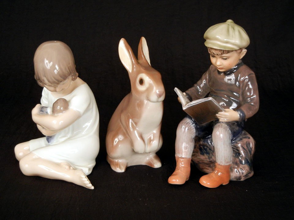 Three Danish figurines including Royal Copenhagen g: Three Danish figurines including Royal Copenhagen girl with doll #1938 5 1/2"; Dahl Jensen boy with book #1096 6"; and B&G rabbit #2423 5"