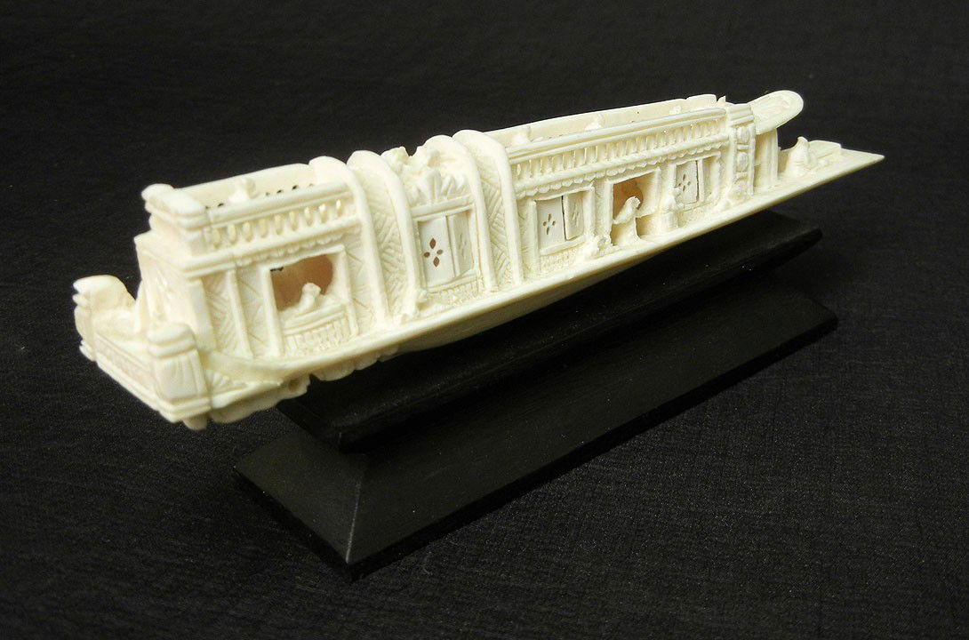 Carved ivory ship, 1 1/4" high x 6", with base 2 1/: Carved ivory ship, 1 1/4" high x 6", with base 2 1/4" high
