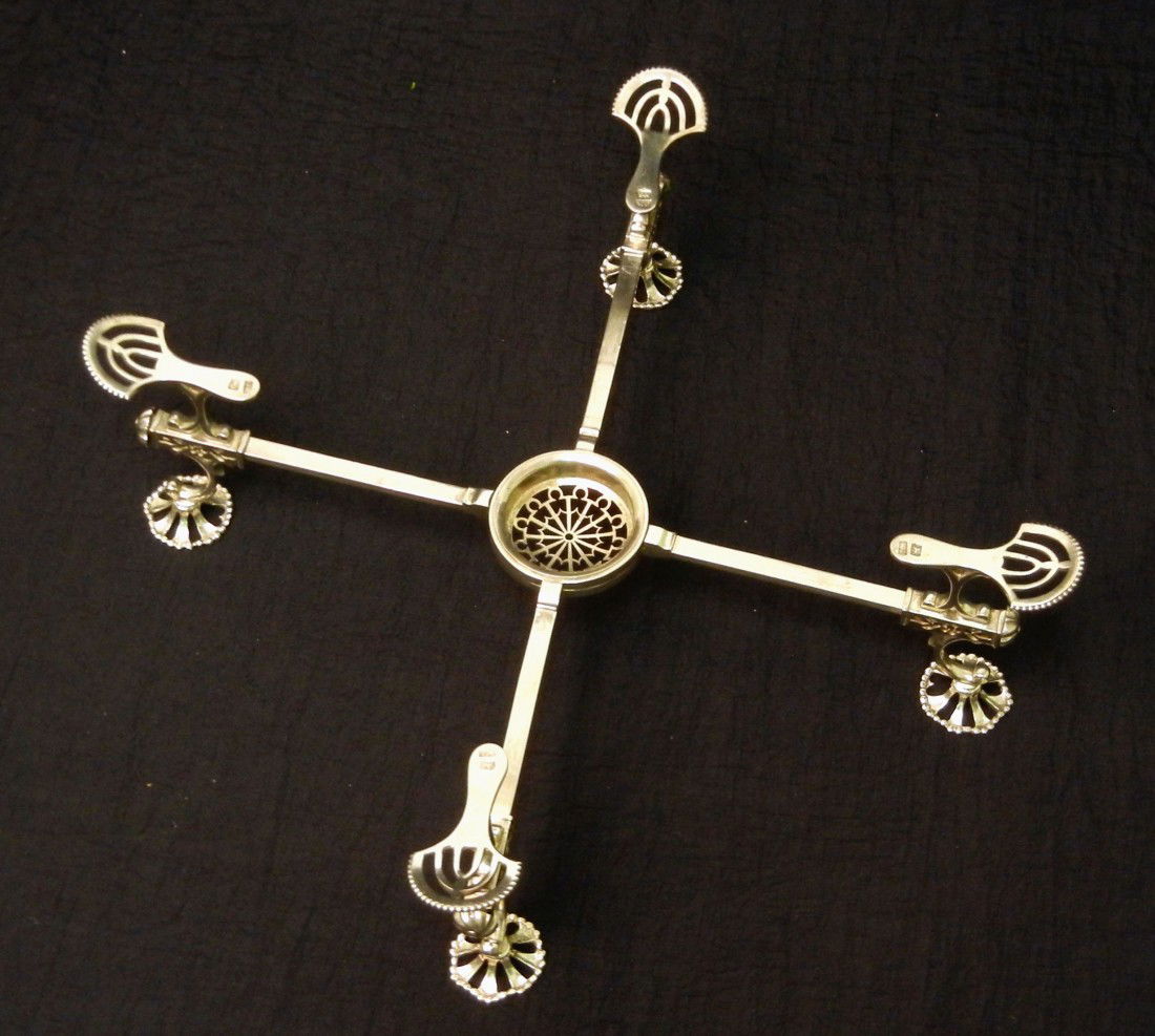 George III silver dish cross, ca. 1780-81 hallmarke: George III silver dish cross, ca. 1780-81 hallmarked W.C. (William Café) London, pierced round feet with beaded rims, pierced center for spirit lamp or candle, adjustable arms, 11 1/4" (closed), x 3