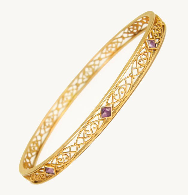 Edwardian yellow gold filigree bangle bracelet wit: Edwardian yellow gold filigree bangle bracelet with purple stones, 14k gold bracelet measures 1/4" wide, inside circumference is 7 3/4", marked 14K, weight 12.4 grams/7.9 dwt, C. 1915