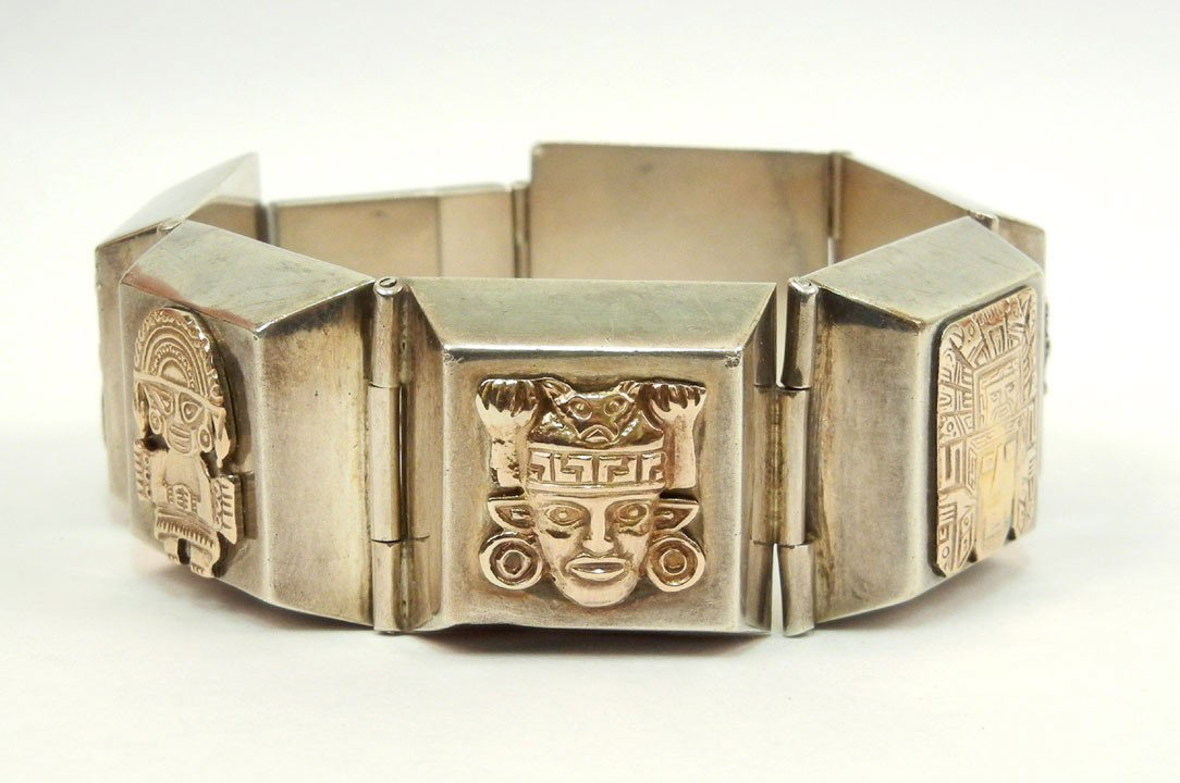 Peruvian sterling silver and 18K gold bracelet, si: Peruvian sterling silver and 18K gold bracelet, six hinged box shaped sections each with applied 18K gold masks and figures, Quero, ancient native tribe motif, 8" long x 1" wide, marked Peru 18K 925, 