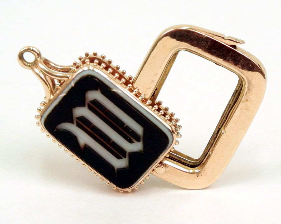 Victorian rose gold agate and carnelian watch fob,: Victorian rose gold agate and carnelian watch fob, black and white banded agate on one side with initial "W" and carnelian on reverse, 1 3/8" long x 7/8" wide, center section swings out to hold pictur