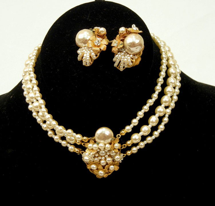 Miriam Haskell costume jewelry necklace and earrin: Miriam Haskell costume jewelry necklace and earrings set, triple strand faux pearl necklace with brass center piece, 13 1/2" long with 2" extender, marked Miriam Haskell on hang tag, matching clip ear