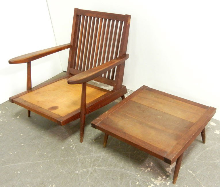 George Nakashima cherry spindle back armchair and : George Nakashima cherry spindle back armchair and footstool, chair measures 30 1/2" high x 29 1/4" x 31", with cushions