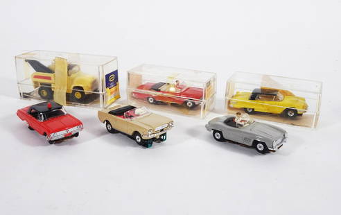 1960's Aurora HO Scale Slot Cars Grouping: Circa 1960's Aurora Products Corp. Model Motoring HO scale five piece slot cars grouping, No. 1364 Thunderjet 500 Int'l. Wrecker (Tow Truck) w/plastic case, No. 1371 Thunderjet 500 Mustang