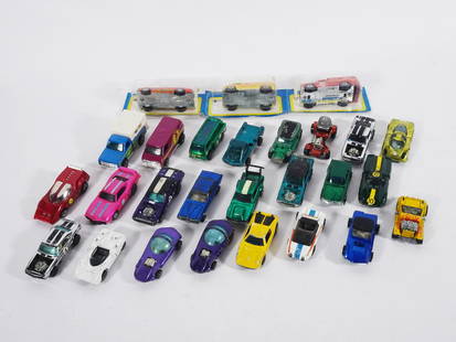 1967-1974 Hot Wheels Redline Vehicles: Circa 1967-1974 Mattel Inc. Hot Wheels vehicles twenty-four piece grouping, 1967 Silhouette (qty 2), 1968 Chaparral 2G, Custom Cougar, Lola GT70 and Python, 1969 Beach Bomb, Heavy Chevy, Jack Rabbit,