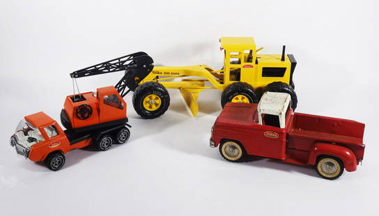 1960's-1970's Tonka Vehicles Grouping: Circa 1960's-1970's Tonka Toys pressed metal vehicles three piece grouping, #302 Pick-Up Truck, #510 Road Grader and #1099 Mini Crane Truck