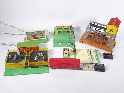 Post War American Flyer Accessories Grouping: Circa 1950-1956 post war A.C. Gilbert Co. American Flyer S Gauge five piece accessories grouping, No. 566 Whistling Billboard, No. 592 Crossing Gate, No. 770 Loading Platform, No. 771 Operating Stock