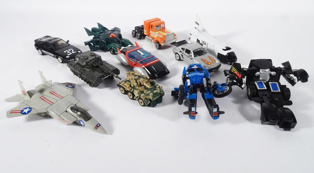 Bandai Gobot and Super Gobot Transformer Grouping: Circa 1983-1985 Bandai Namco Toys eleven piece Gobot Transformer grouping, 1983 Porsche 928S, Porsche 930 Turbo and Super Destroyer Renegade Tank, 1984 Future Machine Car, MK2 Defender Tank and Staks
