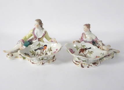 Meissen Porcelain Figural Sweetmeat Dishes: Pair of Meissen German porcelain figural sweetmeat dishes, hand painted reclining male and female figures, dish portions with hand painted bird and floral designs, both are signed on underside of