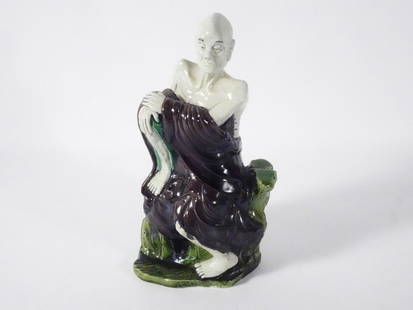 Chinese Porcelain Buddhist Lohan Figure: Chinese Export porcelain Buddhist Lohan figure, polychrome decorated, unsigned, circa mid 19th c. to early 20th c. Qing Dynasty period, 10" (h) x 4 1/2" x 4"