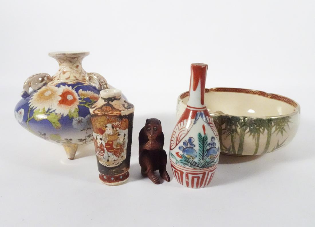 Japanese Decorative Objects Grouping: Five piece Japanese decorative objects grouping, carved boxwood seated monkey with glass eyes and holding a nut in his hands, Kutani porcelain cabinet vase with hand painted floral designs, Satsuma po