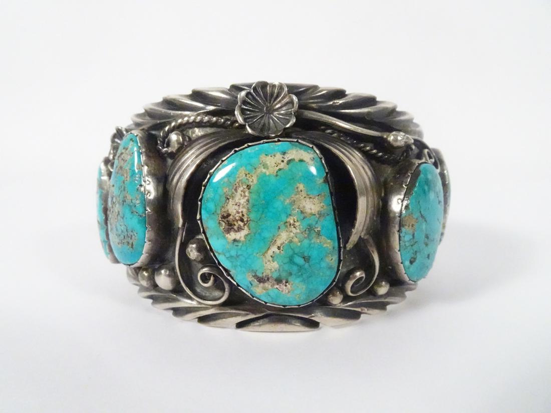 Sterling Turquoise Cuff: Sterling Turquoise Cuff; Weight: 106.0gr; Width: 45-30mm; five turquoise stones bezeled with applied wire, bead, and flower details; Stamped: TD (Tom David, Navajo)