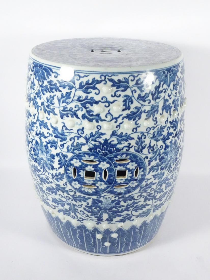Chinese Export Porcelain Garden Seat: Chinese Export blue and white porcelain barrel form garden seat, overall detailed floral design, pierced panels, raised bosses, unsigned, 19th c., 18" (h) x 12 1/2"