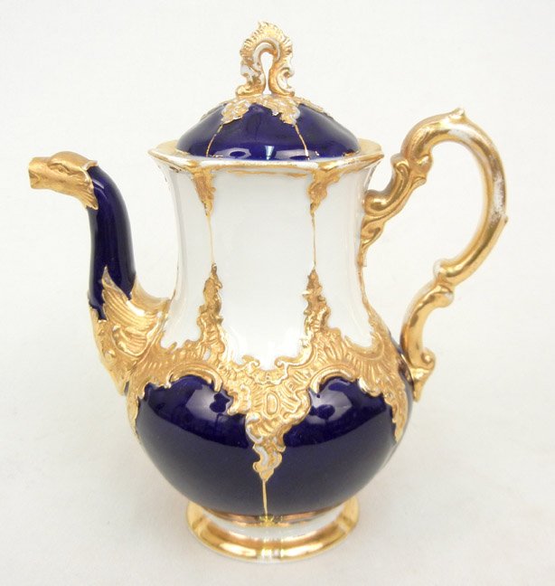 Meissen porcelain teapot, gilt and cobalt decorati: Meissen porcelain teapot, gilt and cobalt decoration, figural spout, blue underglaze crossed swords mark and impressed numbers on bottom, 7 1/2" high