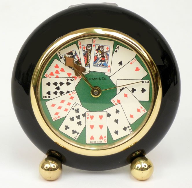 Tiffany & Co. dresser clock, game cards on faace p: Tiffany & Co. dresser clock, game cards on face plate, marked Swiss made, brass back marked Swiss quartz, impressed 205528, 3 1/4" high