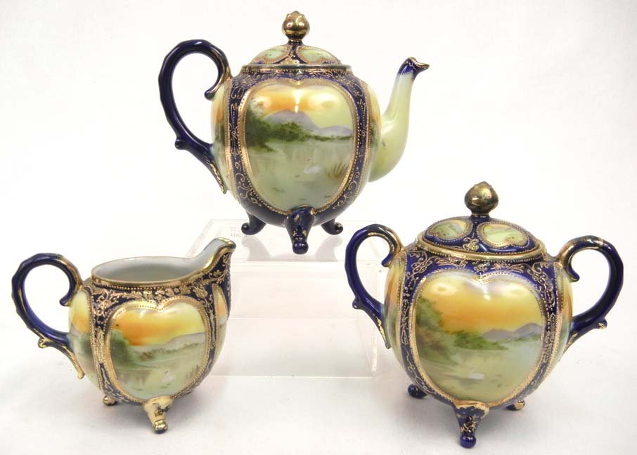 Nippon three piece hand painted tea set, cobalt, g: Nippon three piece hand painted tea set, cobalt, gilt and landscape decoration, early 20th C., teapot 6"