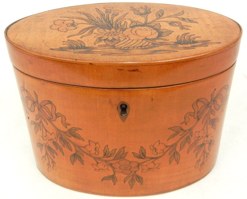 Oval maple inlaid box with hinged ribbon, swag and: Oval maple inlaid box with hinged ribbon, swag and floral inlay, inlaid escutcheon, velvet lined interior, 4 5/8" high x 6" x 3 1/2"