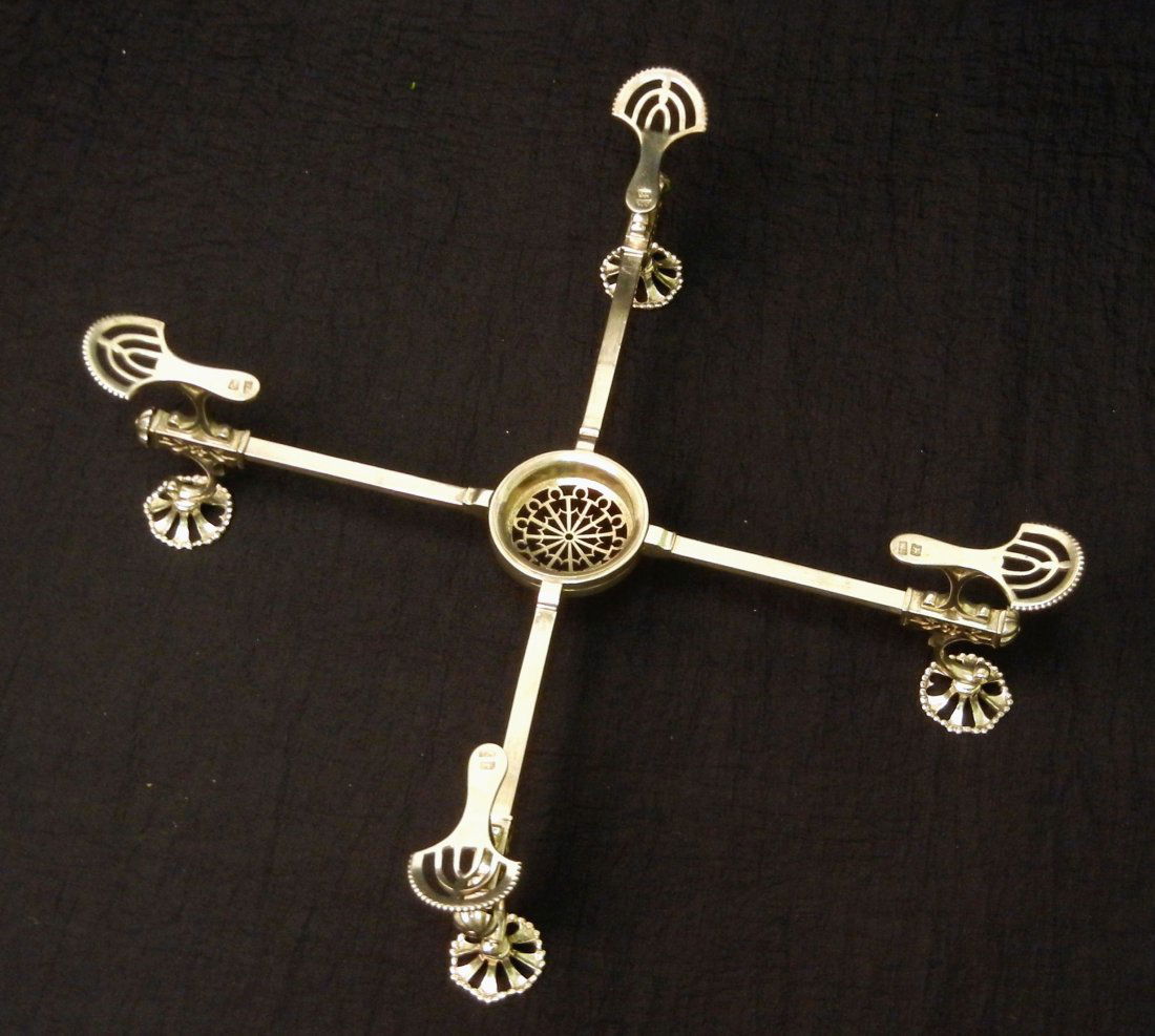 George III silver dish cross, ca. 1780-81 hallmark: George III silver dish cross, ca. 1780-81 hallmarked W.C. (William Café) London, pierced round feet with beaded rims, pierced center for spirit lamp or candle, adjustable arms, 11 1/4" (closed), x 3