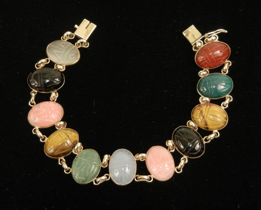 Gold scarab bracelet, 14k yellow gold bracelet wit: Gold scarab bracelet, 14k yellow gold bracelet with carved scarabs measuring 9/16" x 7/16", stones include carnelian, crysophase, tiger's eye, black onyx, rose quartz and chalcedony, 7 1/4" long, mark